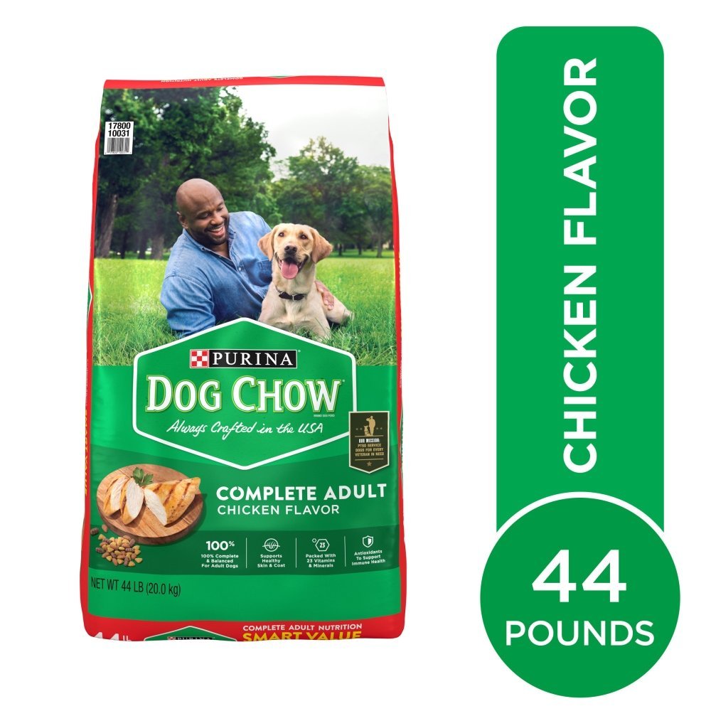 A close-up view of a bag of complete dog food focusing on the nutritional label.