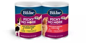 A bowl of premium wet dog food for picky eaters in a kitchen.