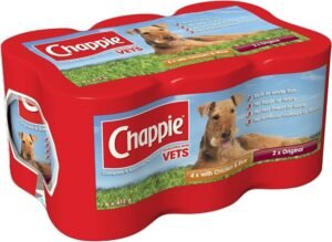 Golden retriever beside Chappie dog food bag on wooden kitchen counter