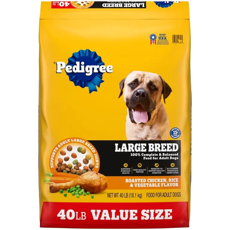 A large bag of dog food stored in a container with a scoop.