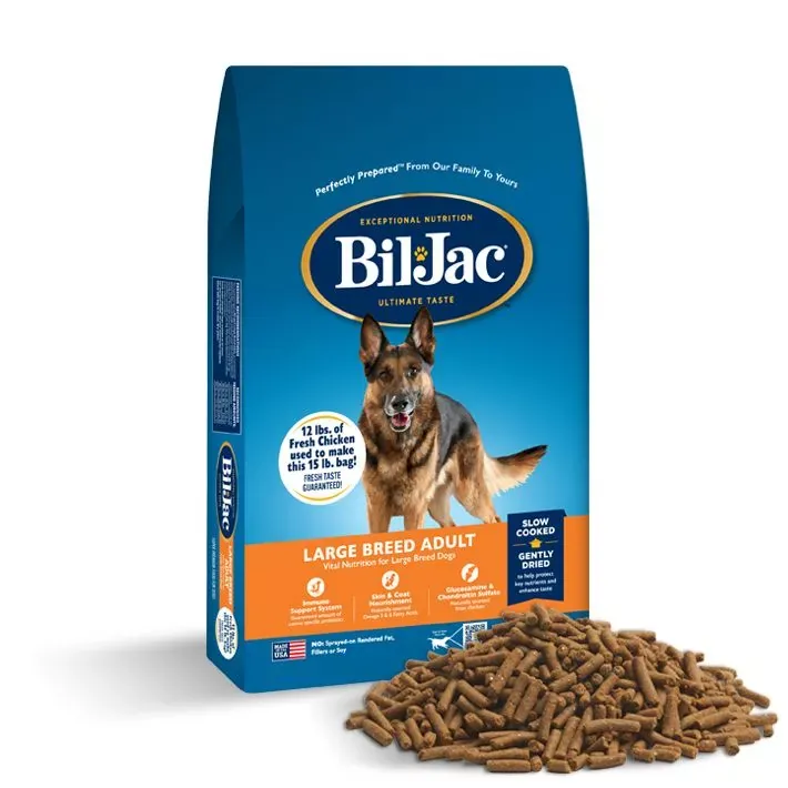Spilled dog food kibble near an empty airtight storage container.