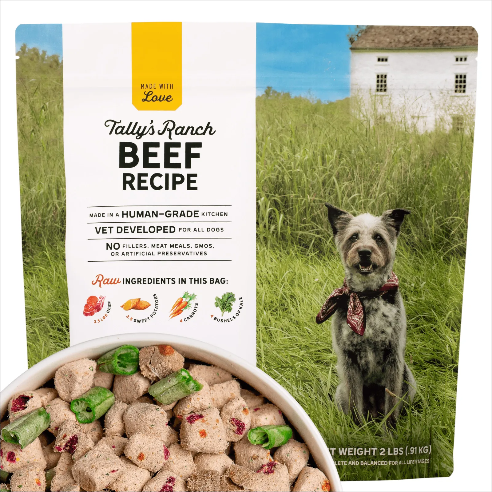 Various dog food bags sit on a wooden table beside a curious brown dog.